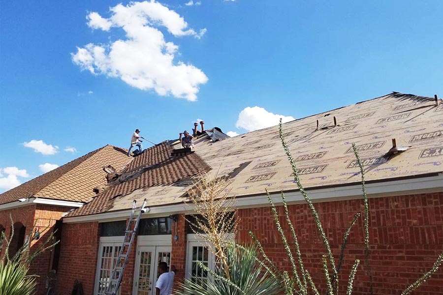 roofers-on-roof-on-brick-home-installing-new-shingles-el-paso-tx